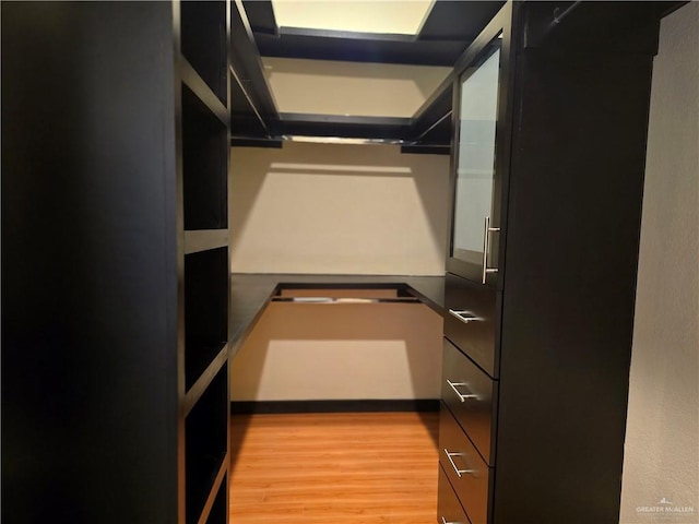 walk in closet featuring light hardwood / wood-style floors