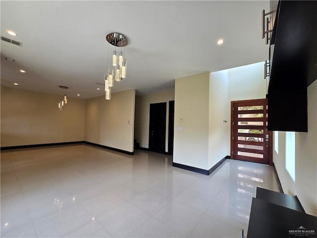 empty room with light tile patterned floors