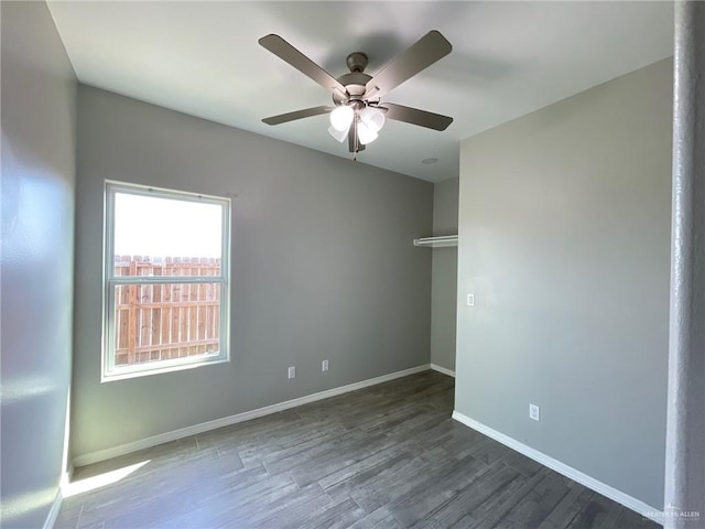 2108 Davenport St, Weslaco, TX 78596 - unfurnished room with a ceiling fan, baseboards, and wood finished floors