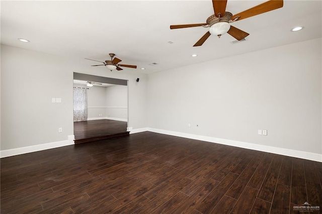 spare room featuring ceiling fan and dark hardwood / wood-style flooring