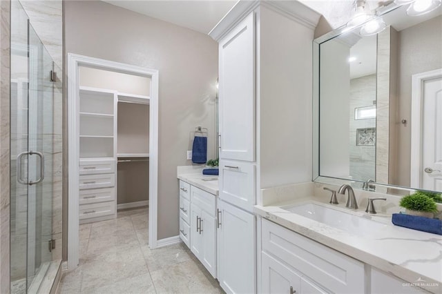 bathroom with vanity and walk in shower