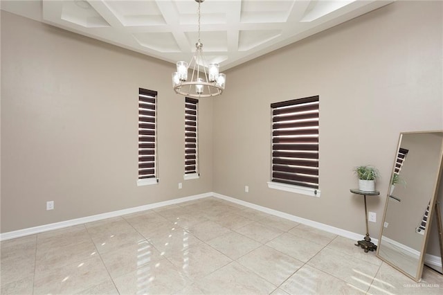 spare room featuring tile patterned flooring, coffered ceiling, an inviting chandelier, and beam ceiling