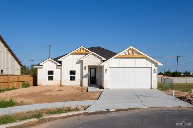 modern inspired farmhouse featuring a garage