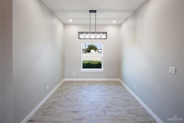 unfurnished dining area with light hardwood / wood-style floors