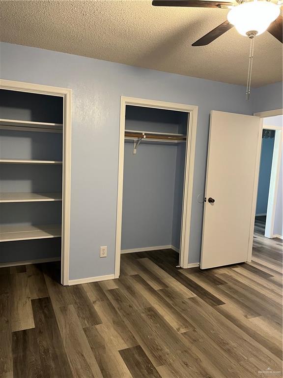 1601 S Oklahoma Ave, Weslaco, TX 78596 - unfurnished bedroom with a textured ceiling, wood finished floors, and ceiling fan