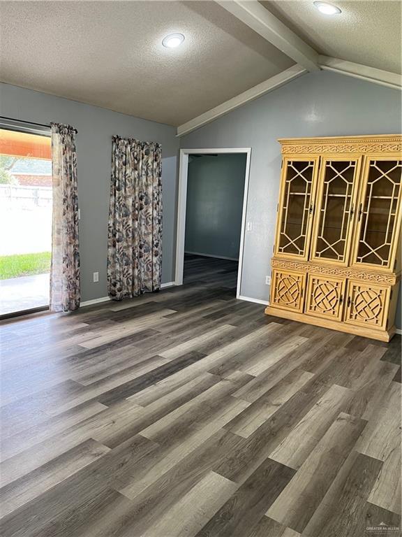 1601 S Oklahoma Ave, Weslaco, TX 78596 - empty room with a textured ceiling, wood finished floors, and recessed lighting