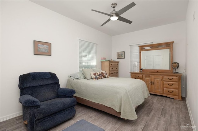 bedroom with hardwood / wood-style flooring and ceiling fan