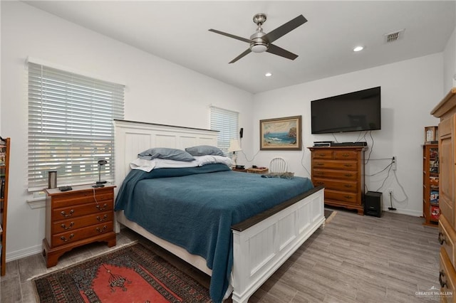 bedroom with light wood-type flooring and ceiling fan