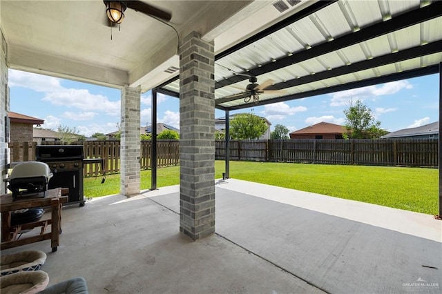 view of patio with ceiling fan and area for grilling