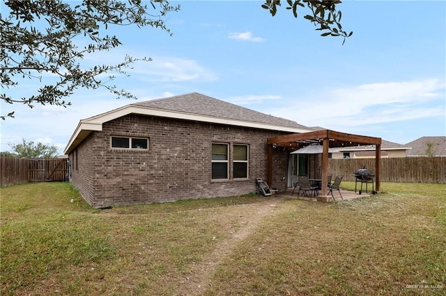 back of property with a patio and a lawn