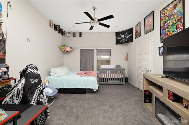 carpeted bedroom featuring ceiling fan