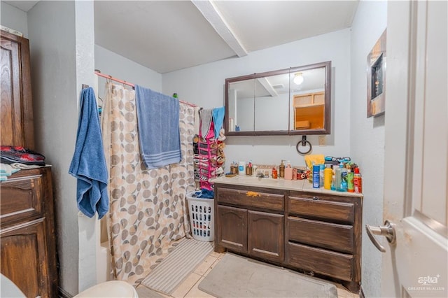 bathroom featuring shower / bath combo, vanity, and tile patterned floors