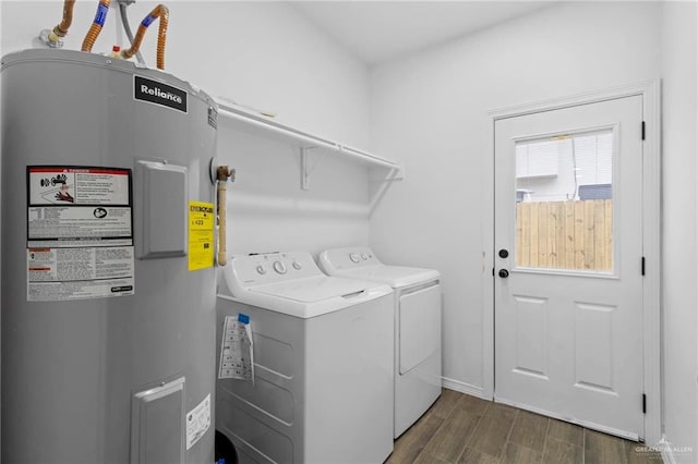 clothes washing area with electric water heater and washer and clothes dryer