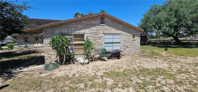 3220 N Taylor Rd, Mcallen, TX 78501 - view of side of property with stone siding and fence