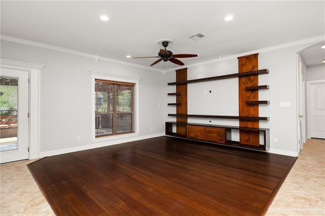 unfurnished living room featuring ceiling fan, ornamental molding, and hardwood / wood-style flooring