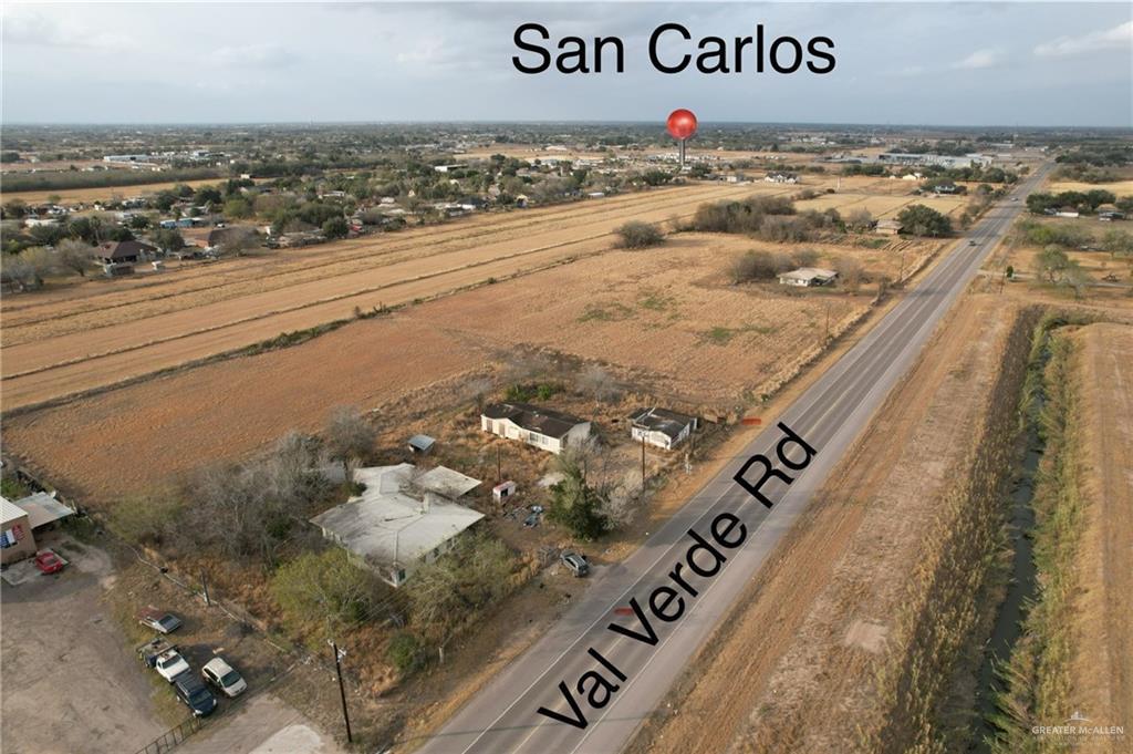 birds eye view of property with a rural view