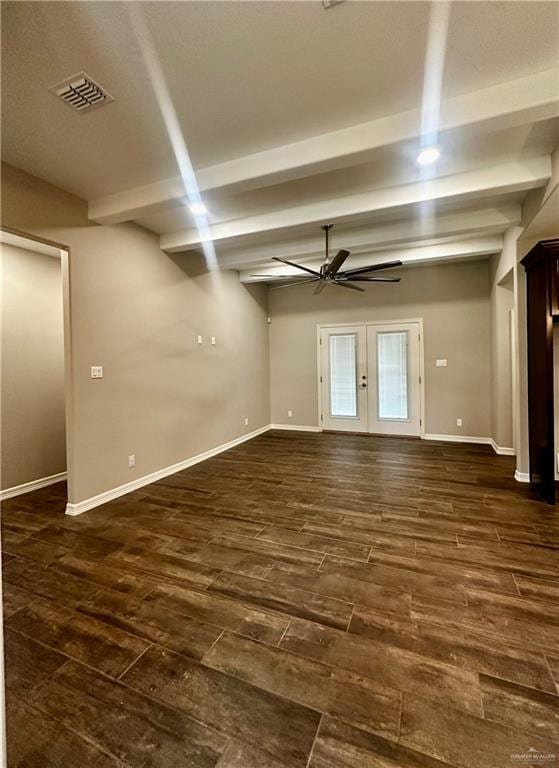 empty room featuring a ceiling fan, beam ceiling, dark wood-style floors, french doors, and baseboards