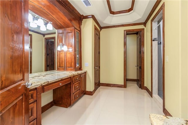 bathroom featuring a shower, vanity, and crown molding