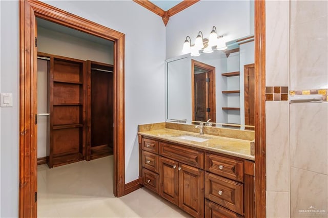 bathroom with vanity and ornamental molding