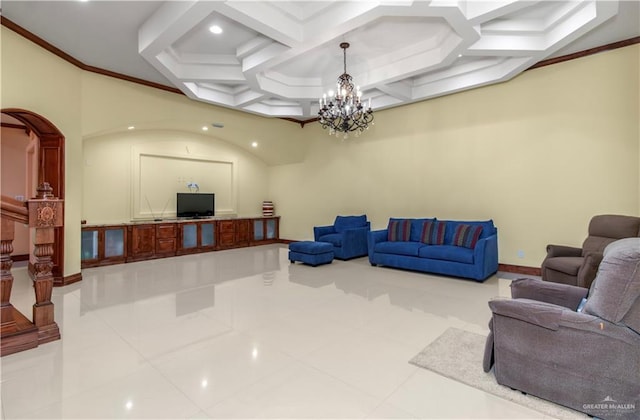 tiled living room with an inviting chandelier, ornamental molding, and coffered ceiling