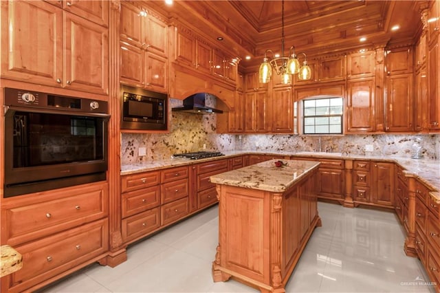 kitchen featuring a kitchen island, built in microwave, pendant lighting, oven, and light tile patterned flooring