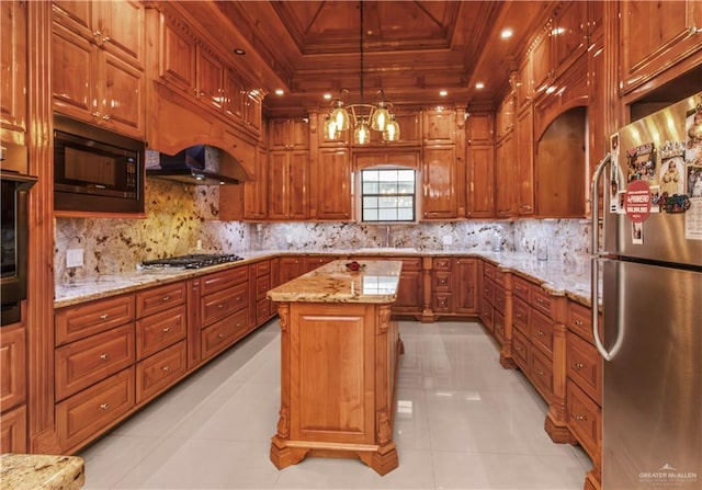 kitchen featuring light tile patterned floors, a center island, hanging light fixtures, and black appliances