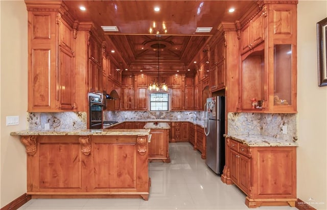 kitchen with hanging light fixtures, decorative backsplash, light tile patterned floors, kitchen peninsula, and stainless steel appliances