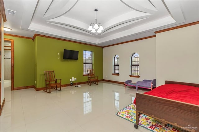 bedroom featuring a chandelier, ornamental molding, and a tray ceiling