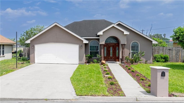 ranch-style house featuring fence, a front lawn, a garage, stucco siding, and concrete driveway