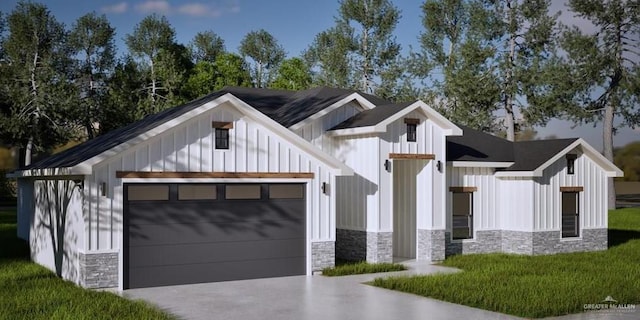 modern inspired farmhouse with a front yard and a garage