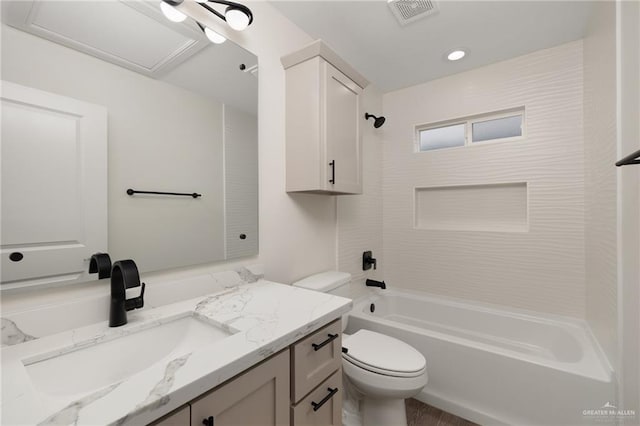 full bathroom featuring vanity, toilet, and tiled shower / bath combo