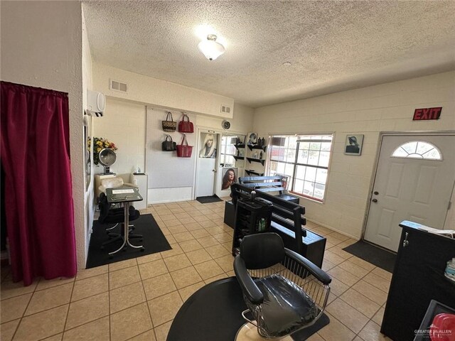 kitchen with light tile patterned floors and a textured ceiling