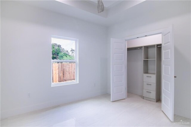 unfurnished bedroom with a closet