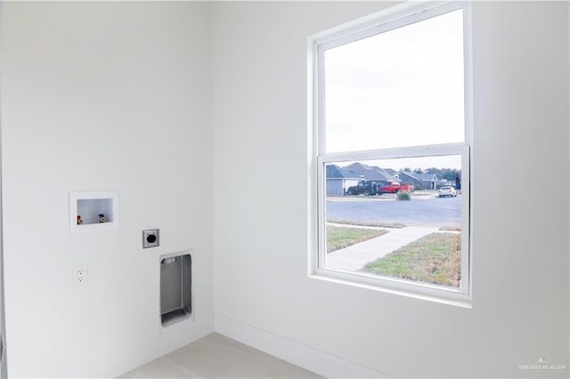 laundry room featuring electric dryer hookup and washer hookup