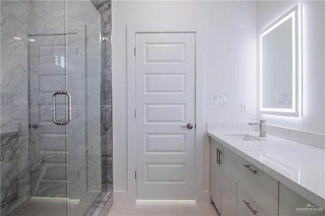 bathroom with vanity and walk in shower