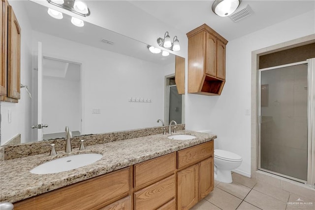 3817 Frontier Dr, Edinburg, TX 78539 - bathroom featuring tile patterned floors, toilet, double vanity, and a shower stall