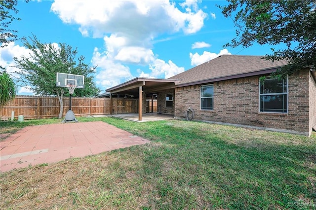 3817 Frontier Dr, Edinburg, TX 78539 - back of property featuring brick siding, a patio area, and roof with shingles