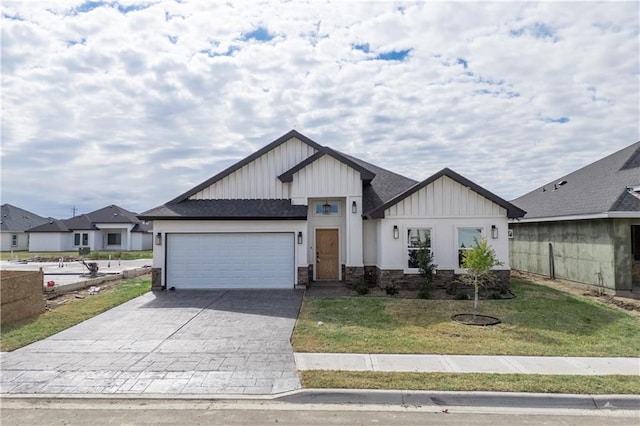 view of front of property with a garage and a front lawn