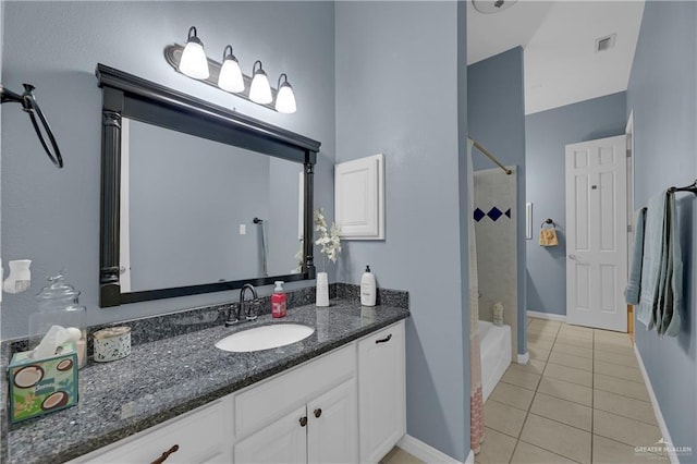 bathroom featuring shower / bathing tub combination, tile patterned flooring, and vanity