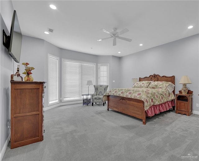 bedroom with light carpet and ceiling fan