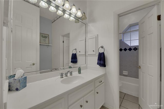 full bathroom featuring tile patterned floors, vanity, tiled shower / bath combo, and toilet