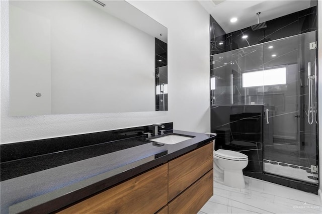 2228 S 45th St, Mcallen, TX 78503 - full bathroom with toilet, vanity, marble finish flooring, a shower stall, and recessed lighting