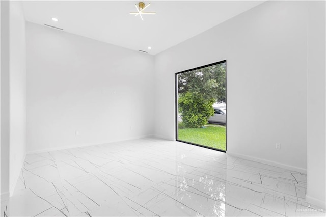 2228 S 45th St, Mcallen, TX 78503 - empty room with marble look tiles, baseboards, and recessed lighting