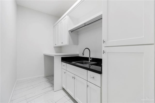2228 S 45th St, Mcallen, TX 78503 - clothes washing area with a sink, light marble finish flooring, and baseboards