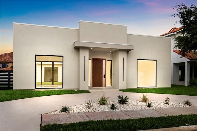 2228 S 45th St, Mcallen, TX 78503 - rear view of house with stucco siding and curved driveway