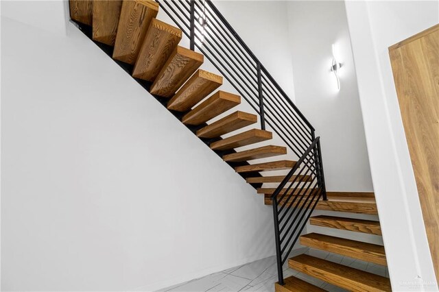 2228 S 45th St, Mcallen, TX 78503 - stairway with marble look tiles and baseboards