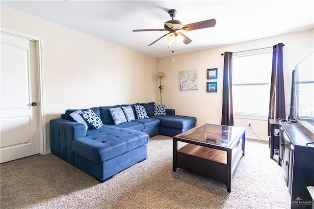 carpeted living room featuring ceiling fan