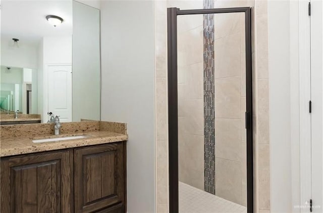 bathroom featuring vanity and walk in shower