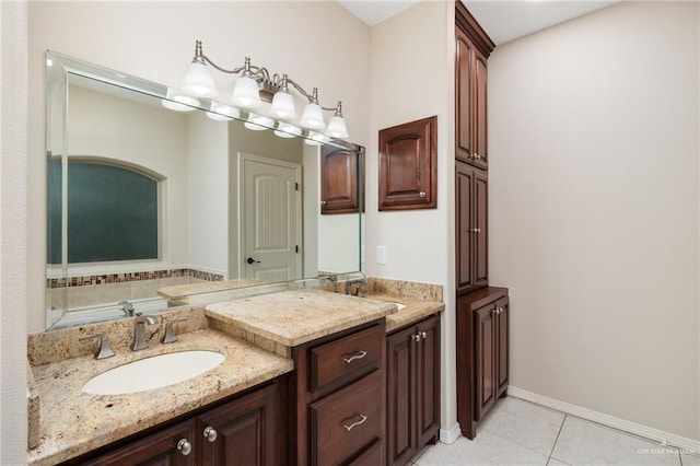 full bath featuring tile patterned flooring, baseboards, and vanity