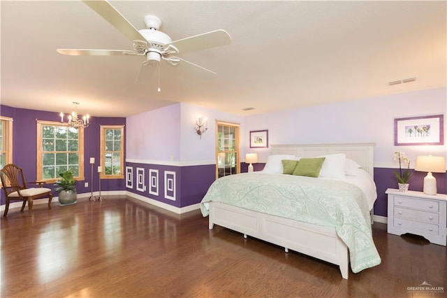 701 S Parker Rd S, La Feria, TX 78559 - bedroom with a chandelier, baseboards, wood finished floors, and ceiling fan